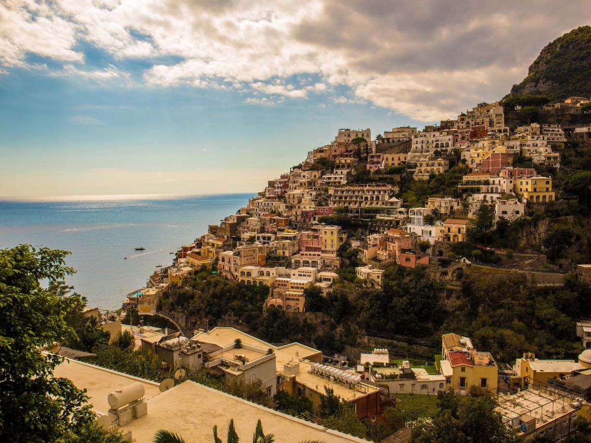 Palermo, Sicily. View of the city from above with houses on the hill and the mediterranean sea in the background.